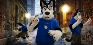 Rating: Safe Score: 0 Tags: 2010 anthro canid canine canis clothed clothing costume domestic_dog e621 ezwolf fully_clothed fursuit graffiti grandfathered_content human male mammal photography_(artwork) real solo street User: bunchy7s