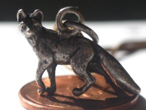 Rating: Safe Score: 0 Tags: 2013 4:3 ambiguous_gender canid canine e621 feral fox grandfathered_content hi_res jewelry mammal metal necklace pendant penny_(coin) photography_(artwork) real solo unknown_artist User: bunchy7s