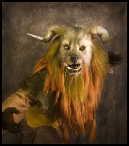Rating: Safe Score: 0 Tags: anthro black_border border brown_body brown_fur clothing costume e621 fur fursuit grandfathered_content horn looking_at_viewer male mane monster qarrezel real robe solo tusks User: bunchy7s