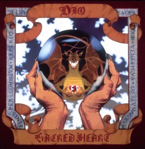 Rating: Safe Score: 0 Tags: 1985 album_cover ambiguous_gender claws cover crystal_ball dio_(band) disembodied_hand dragon duo e621 fangs feral formal_art gem hi_res horn latin_text long_nails membrane_(anatomy) membranous_wings mythological_creature mythological_scalie mythology official_art robert_florczak scalie solo_focus spread_wings teeth text wings User: bunchy7s