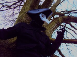 Rating: Safe Score: 0 Tags: 4:3 ambiguous_gender animal_mask beak_mask clothing costume doctor e621 grandfathered_content human human_only mammal mask not_furry photography_(artwork) plague_doctor plant real solo tree wood zideeane User: bunchy7s
