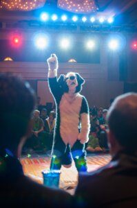 Rating: Safe Score: 0 Tags: ambiguous_gender audience canid canine canis clothing costume crowd dancing domestic_dog e621 female fursuit grandfathered_content group human male mammal photo real rockzorz solo_focus stage tail tommy_bruce User: bunchy7s