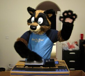 Rating: Safe Score: 0 Tags: anthro blue_eyes clothing costume disc_jockey e621 fursuit gesture grandfathered_content male mammal procyonid raccoon real record_player solo sophiecabra waving User: bunchy7s