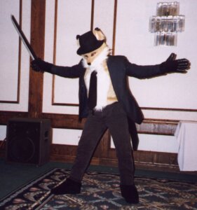 Rating: Safe Score: 0 Tags: 1999 accessory anthro anthrocon canid canine clothed clothing costume e621 fox furgonomics fursuit gloves grandfathered_content handwear hat headgear headwear hotel male mammal melee_weapon necktie photography_(artwork) pose real solo speaker suit sword unknown_artist vintage weapon User: bunchy7s