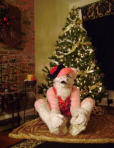 Rating: Safe Score: 0 Tags: animal_skin canid canine canis christmas clothing costume domestic_dog e621 fur fursuit grandfathered_content hair holidays male mammal photography_(artwork) pink_body pink_fur pink_hair pose real solo unknown_artist User: bunchy7s