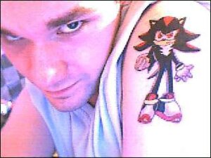 Rating: Safe Score: 0 Tags: 4:3 anthro clothing duo e621 eulipotyphlan grandfathered_content hedgehog human looking_at_viewer low_res male male_human mammal mixed_media photography_(artwork) real sega shadow_the_hedgehog shirt solo_focus sonic_the_hedgehog_(series) tattoo tattoo_(artwork) topwear unknown_artist white_clothing white_topwear User: bunchy7s